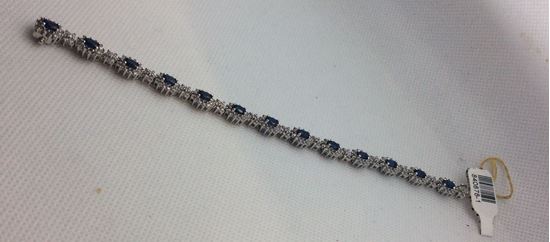 Picture of 14kt white gold bracelet 7 inch with 2.5 carat of diamonds (247 round diamonds ) and 13 blue oval sapphires  . Total weight 18.6 gr . 840878-1. Used.
