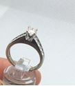 Picture of 14kt white gold engagement ring 3.7 gr with round 0.50 pts main diamond and 8 side diamonds 0.50 size 7.5 804403-1