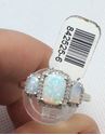 Picture of 14kt white gold fashion ring with 0.25 carat of 40 round diamonds and 3 beautiful opals. Size 9.5 . 3.3 gr . 842525-6. 