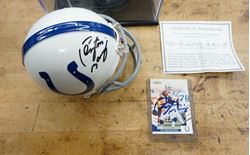 Picture of PEYTON MANNING AUTOGRAPHED MINI HELMET AND SIGNED FOOTBALL CARD; COA; CASE. MINT CONDITION. COLLECTIBLE.