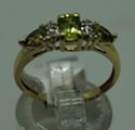 Picture of 10KT YELLOW GOLD RING WITH  4 DIAMONDS 0.02PTS AND 3 PERIDOTS  (1 OVAL; 2 PEAR SHAPE).1.8GR SIZE 7.25 VERY GOOD CONDITION. PRE OWNED.