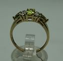 Picture of 10KT YELLOW GOLD RING WITH  4 DIAMONDS 0.02PTS AND 3 PERIDOTS  (1 OVAL; 2 PEAR SHAPE).1.8GR SIZE 7.25 VERY GOOD CONDITION. PRE OWNED.