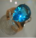 Picture of 14kt yellow gold fashion ring with pear shape light blue topaz stone total weight 5.8 gr . Pre owned . Size 8.25 