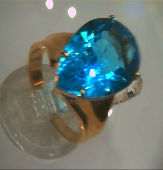 Picture of 14kt yellow gold fashion ring with pear shape light blue topaz stone total weight 5.8 gr . Pre owned . Size 8.25 