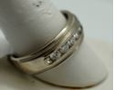 Picture of 14KT WHITE GOLD BAND WITH 8 ROUND DIAMONDS (1 CARAT) SIZE 12 8.6 GR GOOD CONDITION. PRE OWNED. 838998-1.