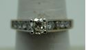 Picture of 14kt white gold engagement ring 3.7 gr with round 0.50 pts main diamond and 8 side diamonds 0.50 size 7.5 804403-1