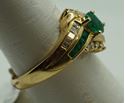 Picture of 14kt yellow gold ring with emeralds and diamonds size 8 5.2 gr total weight .approximately 0.25 carat of diamonds ( 8 round diamonds 10 baguette diamonds) and emeralds 8 e,early cut diamonds 1 oval . 845074-2.