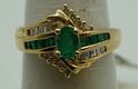 Picture of 14kt yellow gold ring with emeralds and diamonds size 8 5.2 gr total weight .approximately 0.25 carat of diamonds ( 8 round diamonds 10 baguette diamonds) and emeralds 8 e,early cut diamonds 1 oval . 845074-2.