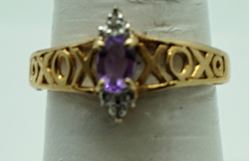 Picture of 10kt yellow gold ring with oval amethyst and 2 small round diamonds . Size 7 . Pre owned. very good. Total weight 2.2  . 824461-4.