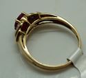 Picture of 10kt yellow gold ring with red stone size 7.25 total weight 2.0 gr . Pre owned.  840097-1.