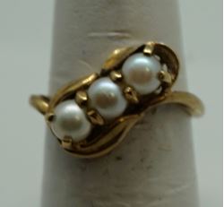 Picture of 10kt yellow gold fashion ring with pearls size 6 pre owned .3 pearls X 4.5 mm. Total weight 2.8 gr . 845765-1. 