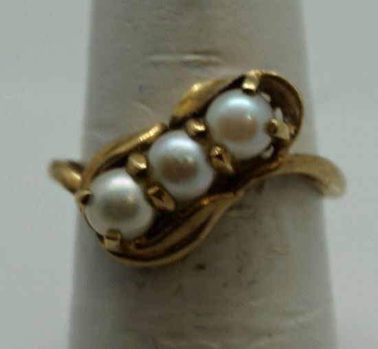 Picture of 10kt yellow gold fashion ring with pearls size 6 pre owned .3 pearls X 4.5 mm. Total weight 2.8 gr . 845765-1. 