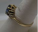 Picture of 10KT YELLOW GOLD RING WITH BLUE STONE AND  8 CZS SIZE 8.5 2.4 GRAMS  VERY GOOD CONDITION. 849283-1. 