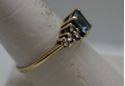 Picture of 10KT YELLOW GOLD RING WITH BLUE STONE AND  8 CZS SIZE 8.5 2.4 GRAMS  VERY GOOD CONDITION. 849283-1. 