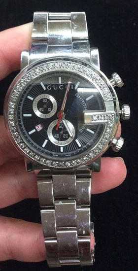 Picture of Gucci stainless steel watch with 50 round diamonds approximately 1 carat 101 chromo 3 ATM water resistant pre owned very good condition 849901-1 