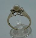 Picture of 10 kt yellow gold ring size 6.5 2.3 gr with 5.5 mm pearl and 2 small diamonds (0.01 pts ) . pre owned. very good condition. 850319-1.