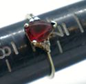 Picture of 10KT YELLOW GOLD RING WITH  PEAR SHAPE GARNET SMALL DIAMONDS 1.5 GRAMS SIZE 7.25. PRE OWNED. VERY GOOD CONDITION. 853506-1.