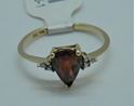 Picture of 10KT YELLOW GOLD RING WITH  PEAR SHAPE GARNET SMALL DIAMONDS 1.5 GRAMS SIZE 7.25. PRE OWNED. VERY GOOD CONDITION. 853506-1.