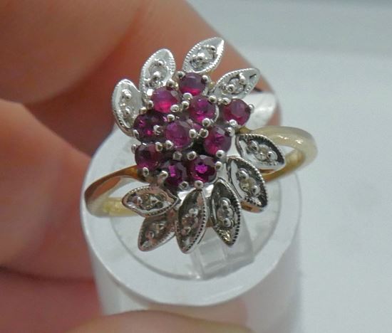 Picture of 14KT YELLOW  GOLD CLUSTER RING SIZE 7 5 GRAMS WITH 10 ROUND DIAMONDS 0.10PTS; RED STONES.  PRE OWNED. VERY GOOD CONDITION. 853791-1.