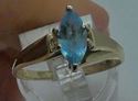 Picture of 14KT YELLOW GOLD FASHION RING WITH LIGHT MARQUISE BLUE STONE SIZE 8.75 3.4 GRAMS. PRE OWNED. VERY GOOD CONDITION. 852678-1.