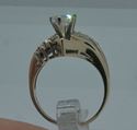 Picture of 14kt  yellow gold ring size 6.5; pre-owned. very good condition. with baguettes diamonds, round, marquise . total weight 2 carat. 5.6 grams . 843726-1.