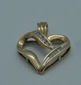 Picture of 10kt yellow gold heart pendant with 6 baguette diamonds and 4 round 2 grams 833378-1