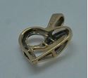 Picture of 10kt yellow gold heart pendant with 6 baguette diamonds and 4 round 2 grams 833378-1