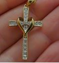 Picture of 10kt yellow gold cross with heart and 0.15pts of diamonds 815230-1