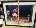 Picture of " MUHAMMAD ALI KNOCKS OUT SUNNY LISTON" . AUTOGRAPHED. FRAME SIZE 22X25 . PICTURE SIZE 19X22. WITH GRANDSTAND SPORT HOLOGRAM, ONLINE AUTHENTIC HOLOGRAM .